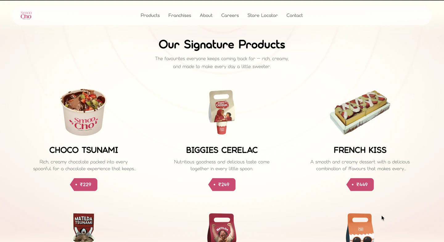 The "Our Signature Products" section — a three-column grid of Choco Tsunami, Biggies Cerelac and French Kiss, each with a pack shot, a short description and a price tag (₹229, ₹249, ₹449), with a second row beginning below.